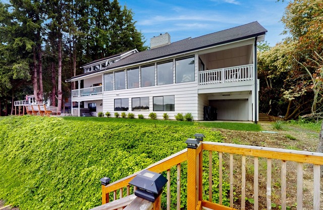 Waterfront home with hot tub, deck pool table and firepit