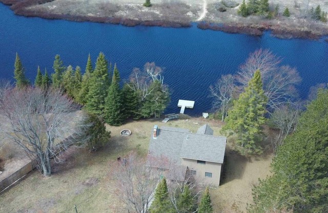 Waterfront house w/ large garage located on trail 8 in Grand Marais.