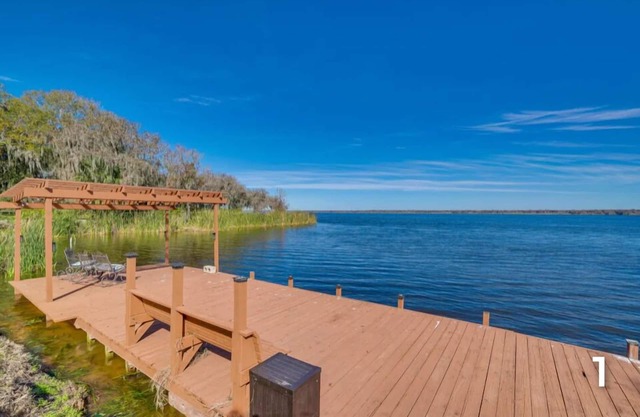 Waterfront property with a private dock & exceptional views of the lake & canal.