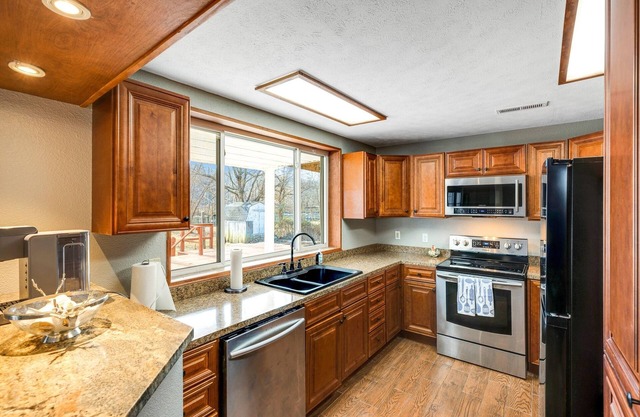 Waterfront Retreat at Rockaway with Fishing Dock by RedAwning