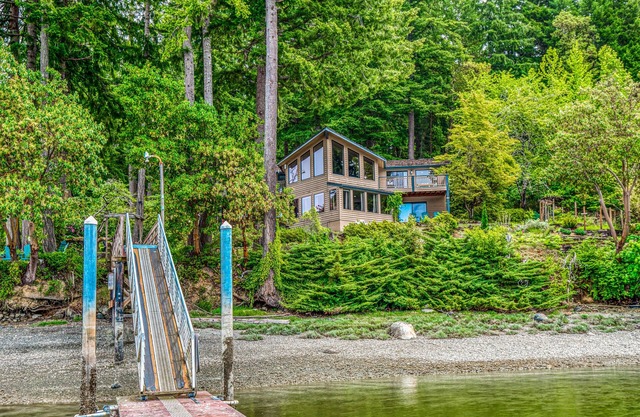 Waterfront retreat on 1.4 forested acres with amazing views & private dock