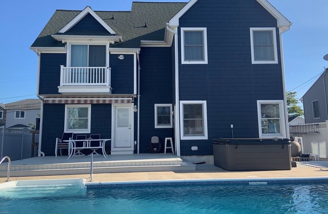 Welocme to this Vacation Oaisis, with a Heated Pool and Hot Tub
