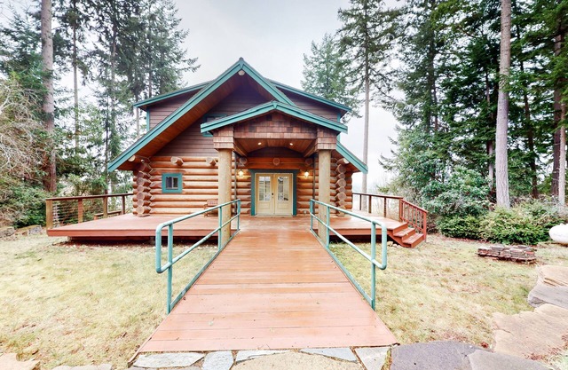 Whimsical island stay with Sound view, grill, wrap-around balcony, & game room