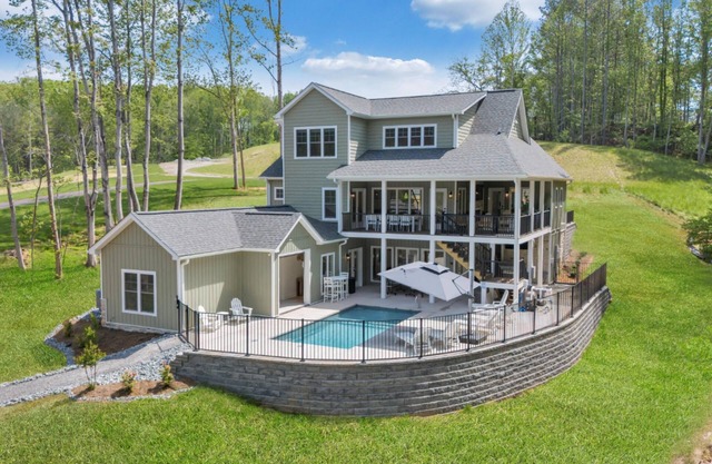 Whispering Pines Estate, Waterfront Luxury w/ Covered Verandas + Heated Salt Pool, Hot Tub, Dock!
