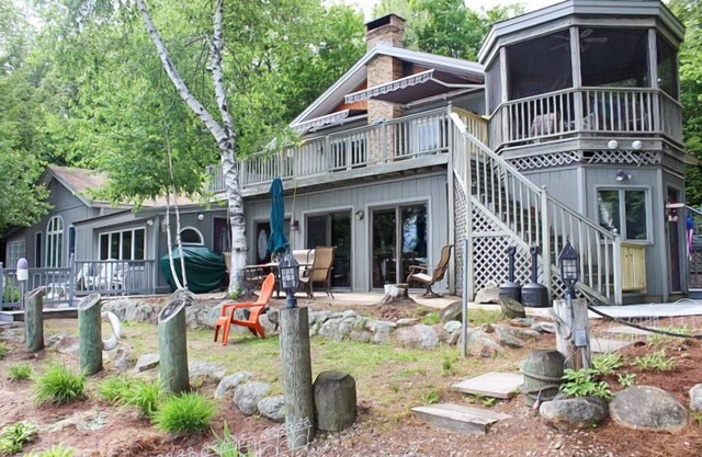 Winnipesaukee Waterfront Home sleeping 12 dock and sandy beach