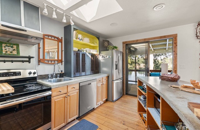 Your eclectic escape! Lakefront home in Lacey w/private patios and dock