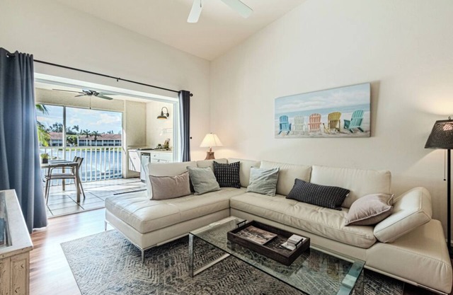 Extensive lanai with outdoor kitchen enhanced by splendid water view.