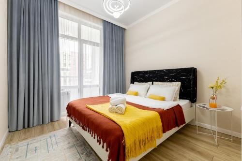 Nur-Sultan Wohnung | Апартаменты возле Хан-Шатыра и Ботанического Сада