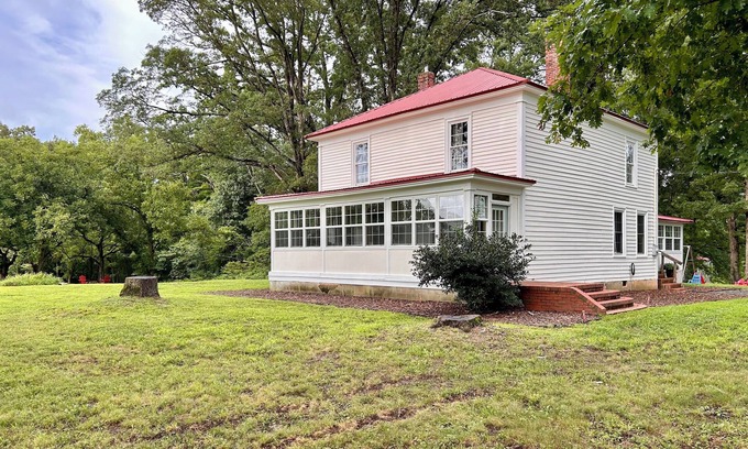 Clarksville Haus | 1920s farmhouse with a water view, and 6 miles to downtown Clarksville.