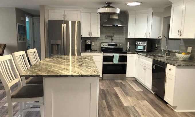 Port Richey Haus | 2/2 Canal Front w/10,000 covered boat lift and floating dock.