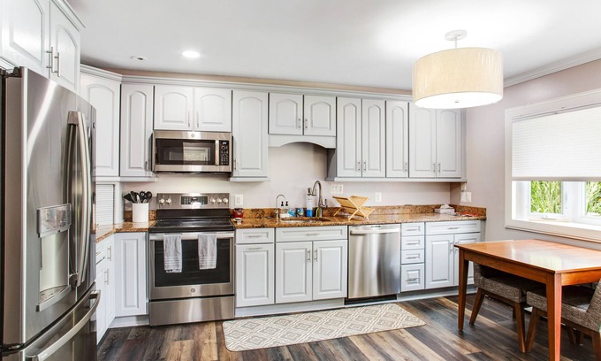 Edgewater Haus | 2-story, riverfront home with private dock, inviting deck & dog-friendly yard