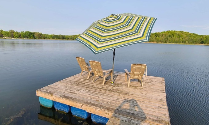 Delton Haus | 3 bedroom home on a peaceful private no wake lake. With kayaks and floating deck