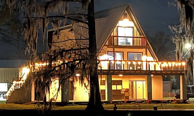 Burnside Haus | 3 levels, 3 bed room spacious waterfront home is located in the Maurepas Swamp