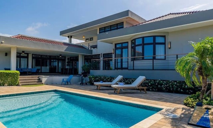 Malmok Villa | 5BR w/ Private Pool, Balcony, Deck & Scenic Views at La Colina 11 by Bocobay