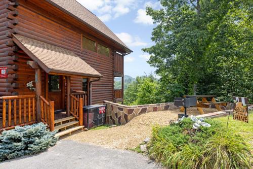 Gatlinburg - Pigeon Forge Haus | A Taste Of Honey is a dog-friendly two bedroom true log cabin nestled inside the Starr Crest resort