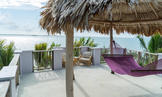 Thatch Caye Resort | Breezy Oceanfront Cabana w/ Walk-In Shower & Private Rooftop Deck