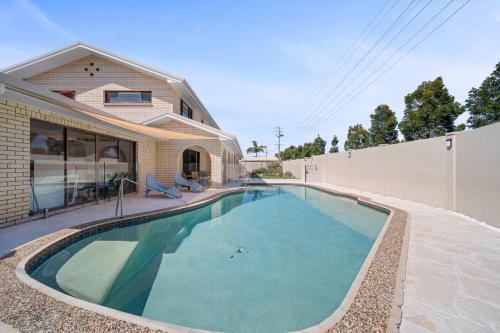 Woorim Haus | Bribie Beach House with Pool - Walk to Surf & Shops