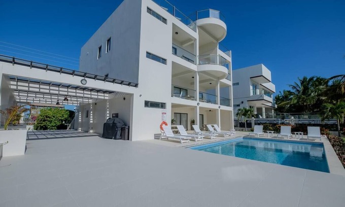 San Pedro Haus | Casa Blanca - Luxury Beachfront Home with Private Boat