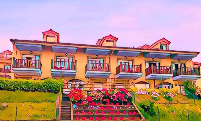 Comillas Wohnung | Casa de Las Flores - Apartamento con jardín privado frente a la Playa de Comillas