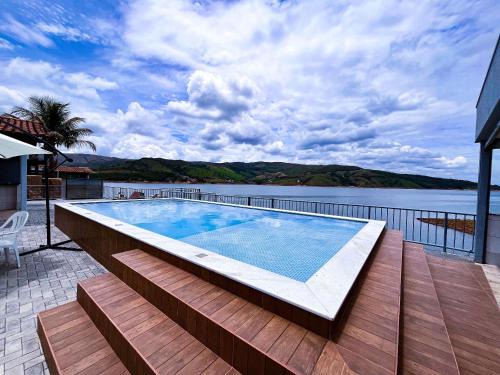 Capitolio Haus | Casa em Capitólio com piscina e vista para lago | W1