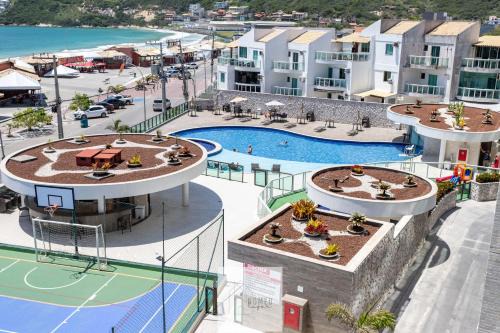 Taio Wohnung | Condomínio Club a 50m PRAIA dos Anjos - Unidades com 2 QUARTOS, PISCINA, estacionamento e portaria 24h - Área de lazer 3000m, wi-fi 800MB, churrasqueira e cozinha completa