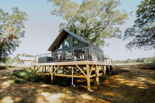 Coosa Haus | Cozy Modern Cabin with Deck and Hot Tub in Cedar Bluff, Alabama