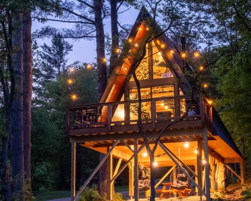 Johnson Haus | Designer A-Frame Treehouse with hot tub on river