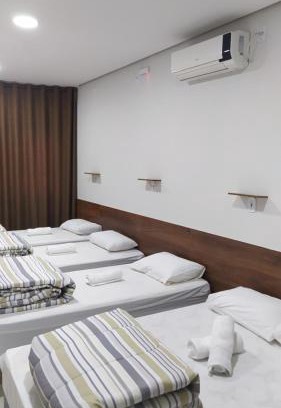 Aparecida Haus | Flat familiar com ar,wi fi,cozinha e garagem