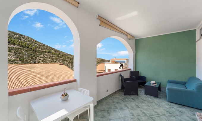 Buggerru Haus | Holiday Home 'Buggerru Hugo' with Sea View, Private Terrace and Air Conditioning