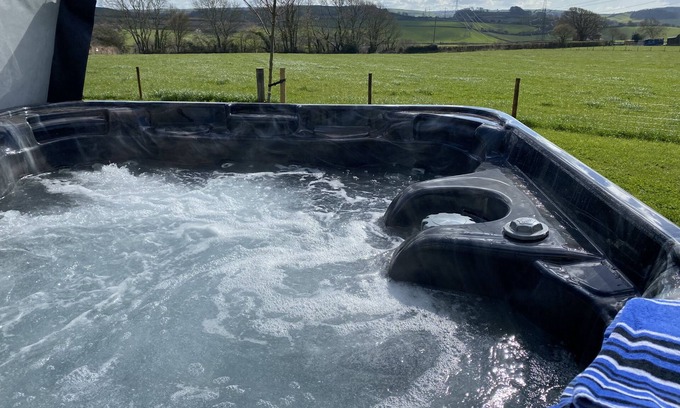 Bridport Kabine | This bespoke handmade shepherd's hut, has a stylish modern interior which includes a well-equipped k