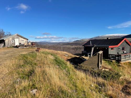 Dovre Haus | Koselig hytte med uthus på vakre Dovrefjell