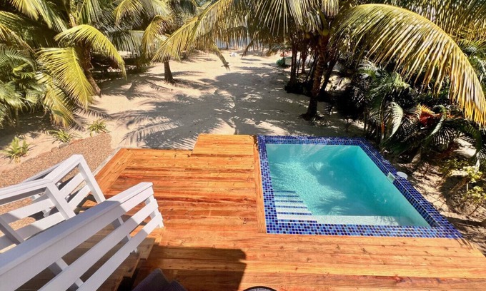Caribbean Way Haus | La Vida Casita - Cozy beachfront bungalow steps from the beach.
