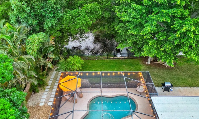 Palma Sola Haus | Luxurious Pool on the Lakefront w/ Private Dock