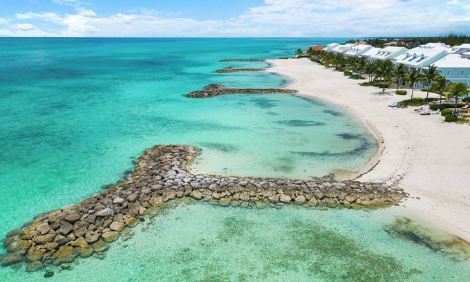 Palm Cay Haus | Luxury Beach side escape, steps from private beach, restaurant, marina, and café