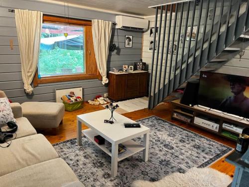 Etelainen Haus | Mökkituulos, beds for 4 One big bedroom, two beds separated with a big wardrobe