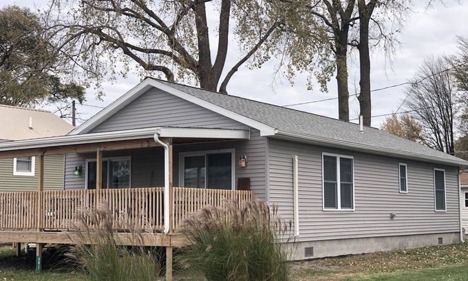 Oak Harbor Haus | New! 30 seconds from couch to shore, covered front porch w/sunset water views.