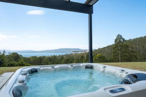 Lower Snug Haus | Ocean views, spacious & private, hot hub
