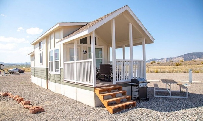Meeker Haus | Our largest "not so tiny" tiny home, White River Casita is a beautiful modern tiny home that features a Queen bed on main level, one Queen bed in loft accessible by stairs, one Queen fold out couch with additional sleeping space in loft for sleeping
