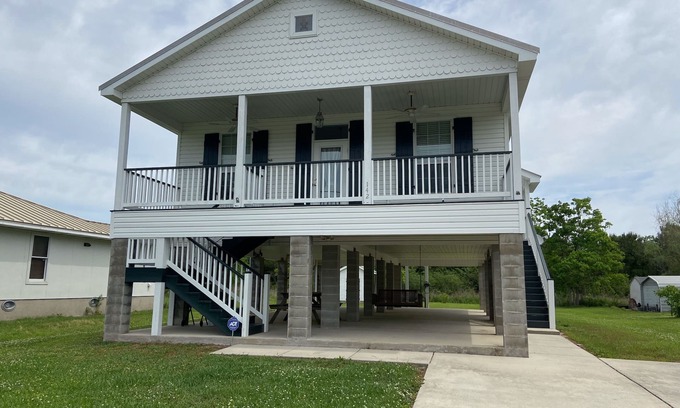 Waveland Haus | Pretty raised three bedroom beach home awaits you! A short 3 min. walk to beach!