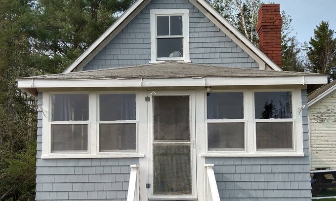 Dennysville Hütte | Rustic, two-story, clapboard cottage, field view, Pet-friendly, Downeast Maine