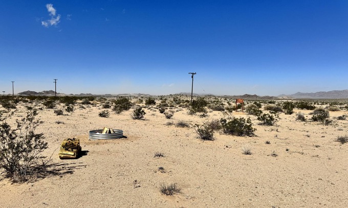 Wonder Valley Wohnmobilvermietung | Campground with fire pit under the stars