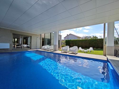 Sanxenxo Haus | Sanxenxo Casa Rial 47 con PISCINA CLIMATIZADA