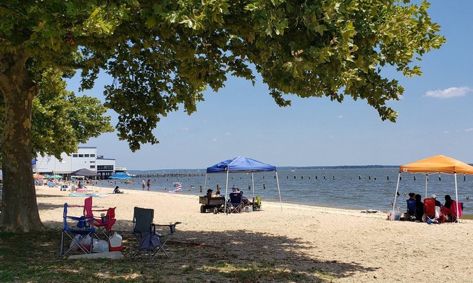 Colonial Beach Haus | Seaside Serenity: Charming Cottage Steps from Sandy Beach & Downtown Delights