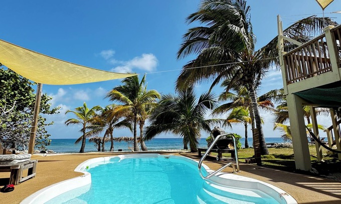 West End Haus | Secluded Sunsets 3400 Sq Ft Villa with 3 Separate Suites on the Ocean with Pool!
