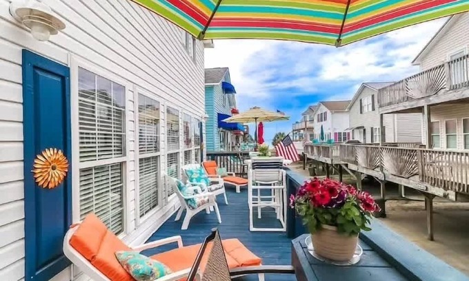 Surfside Beach Haus | Soak in the salty breeze on the awesome deck with a great ocean view! Site 920