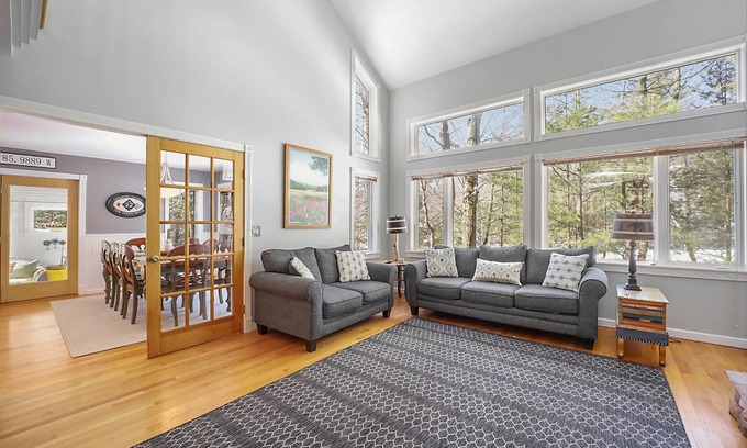 Maple City Haus | Spacious home with studio, lake access, sunroom, fireplace, W/D, & central AC