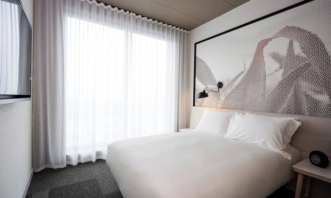 Brossard Hotel | Stay Steps Away from Shopping & Dining in Functionally Designed Room | 3 Units