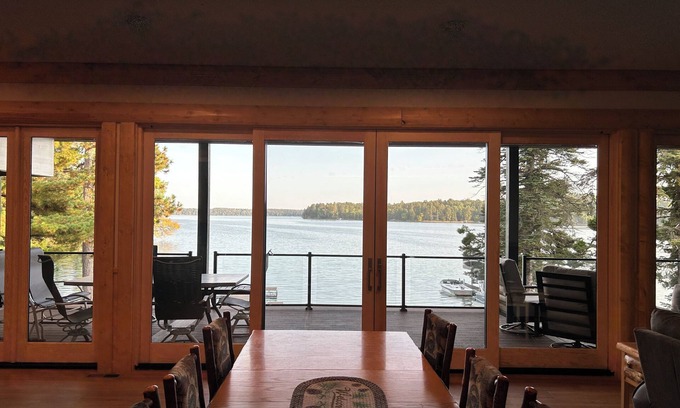 Park Rapids Haus | The Canopy with a wall of windows overlooking Big Sand Lake.