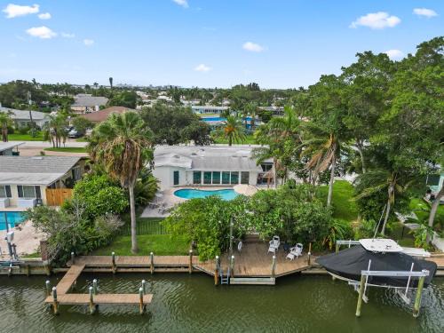 Venetian Way Haus | The Cocoa Plum - A Quiet Riverfront Pool Home Near Beach