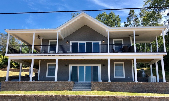 Mid-Coast and Islands Haus | This spacious home offers a FANTASTIC covered porch, perfect to spend your days gazing at the ocean!